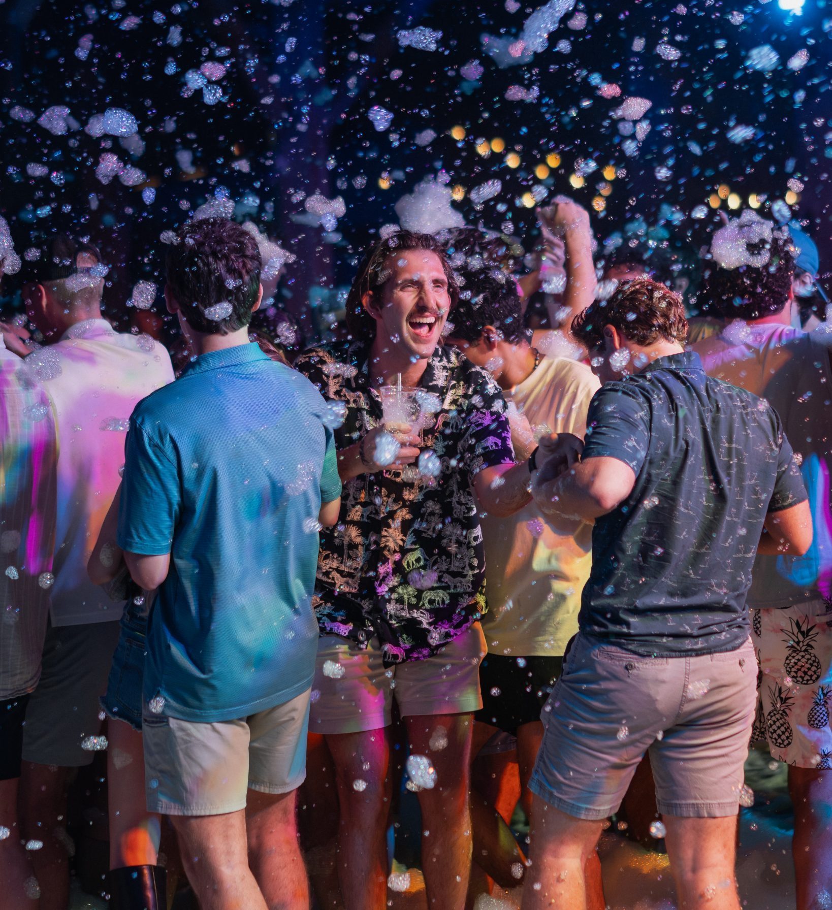 Friends dancing in foam at the Hammerhead Fred's foam party, Panama City Beach
