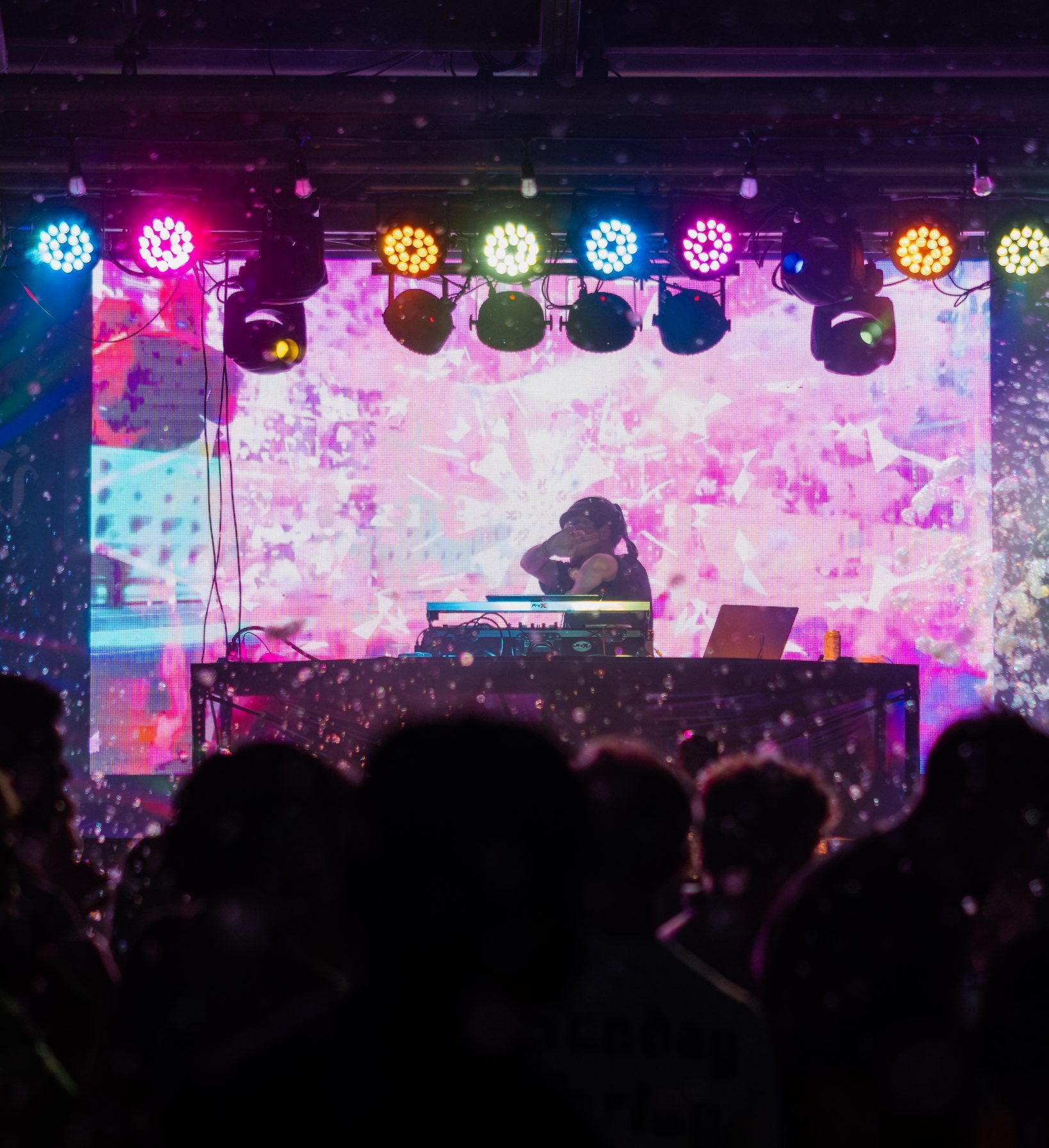 Colorful stage lights and foam above the crowd at the Hammerhead Fred's foam party
