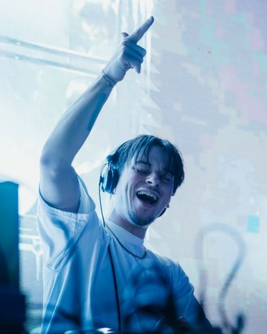 Dj Arms Raised Laughing DJ with arms raised laughing behind the decks, Panama City Beach