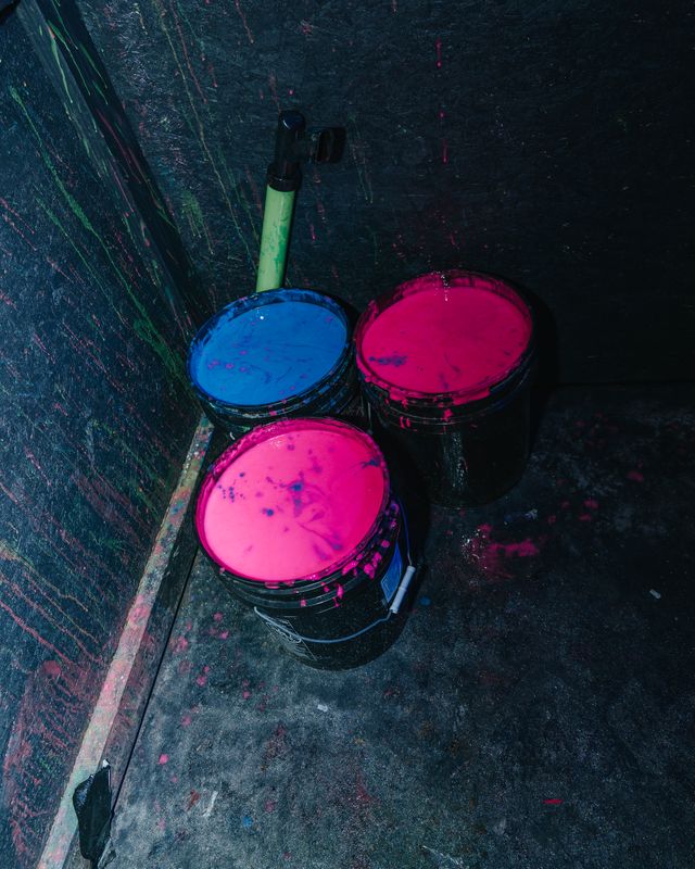 Neon Paint Buckets Pink Blue Buckets of pink and blue neon paint glowing in the dark, Panama City Beach