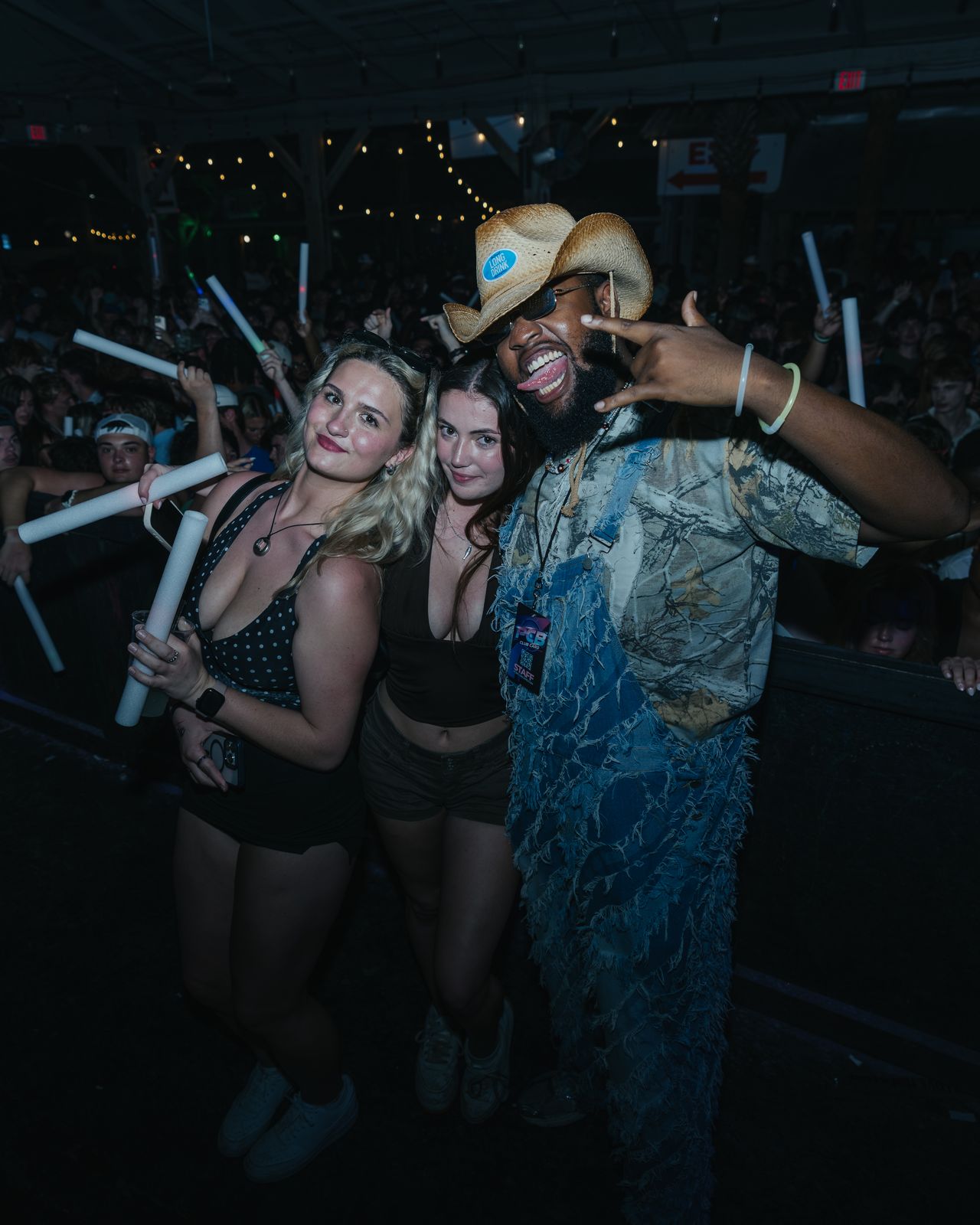 Woman Friend Cowboy Hat Glow Stick Woman and a friend in a cowboy hat posing with a glow stick at night, Panama City Beach